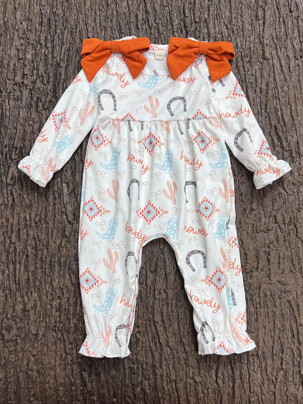 Howdy" Printed Girls Baby Romper W/Rust Side Bows.

________________