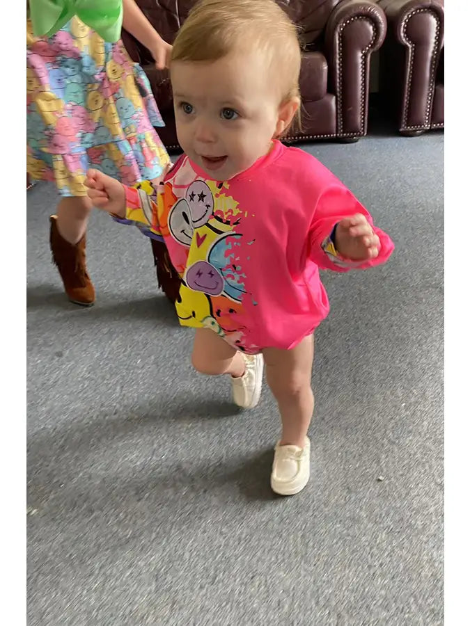 Half Smile Face & Pink Baby Onesie